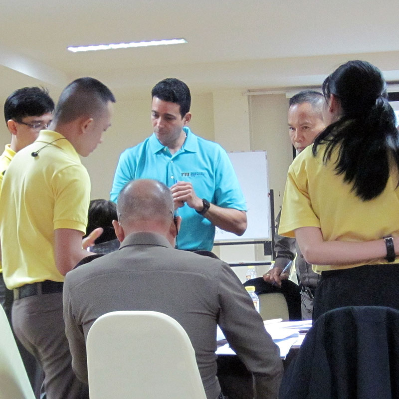 an instructor explains DNA mixtures to trainees