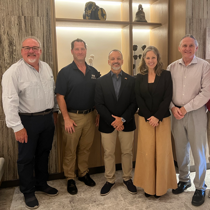 a speaker presenting to a group of laboratory managers