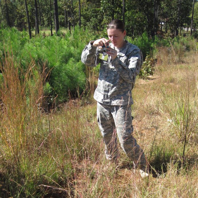 a soldier uses field photography techniques